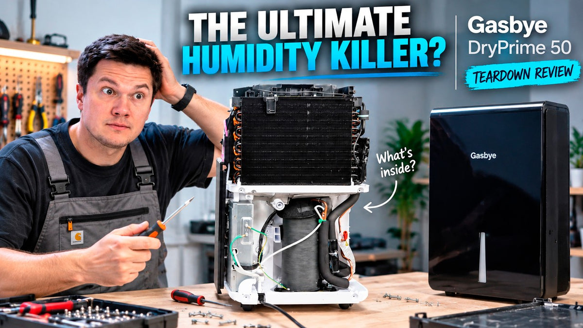 A man in work clothes sits at a table holding a screwdriver next to an open Gasbye DryPrime 50 dehumidifier showing its internal components, with a second closed refrigerator on the table and large promotional text overlays.