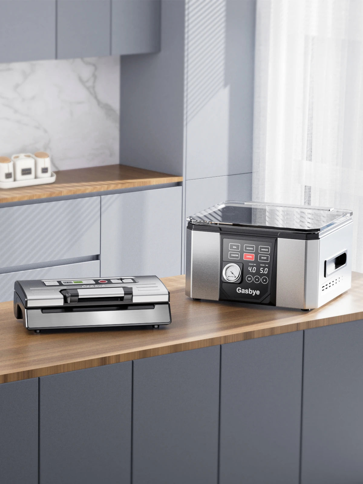 Two vacuum sealers on a kitchen counter with a modern kitchen background