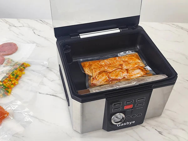 Vacuum sealer with food packaging on a white surface